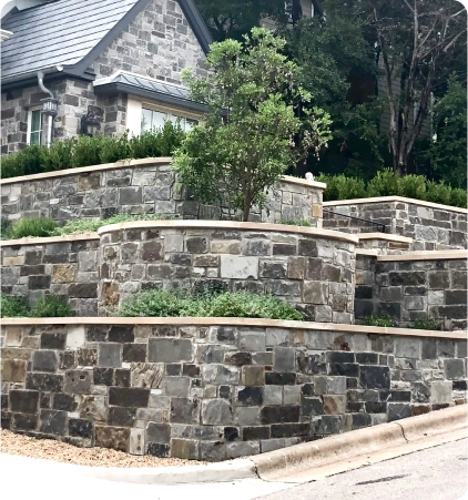 Three-tier retaining wall built and designed by J&L Hardscapes.