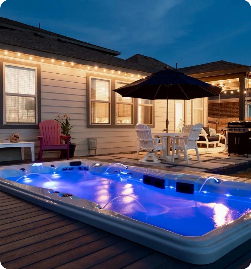 In-ground spa in an Austin backyard at dusk.