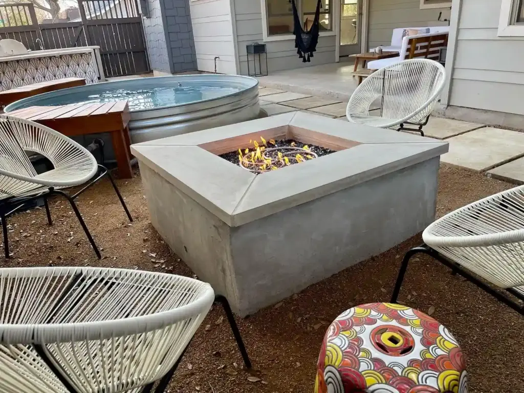 Hardscape 10 Outdoor Living Space Ideas Worth Stealing for Your Austin Backyard 2 A lovely firepit for a small Austin backyard, designed for use all year long