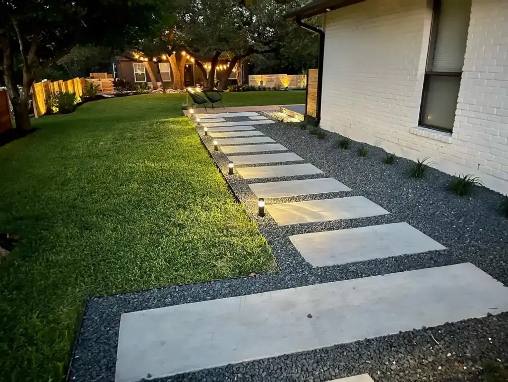 Hardscape 10 Outdoor Living Space Ideas Worth Stealing for Your Austin Backyard 6 Stone walkway in between house and grass providing functionality and beauty to an outdoor space
