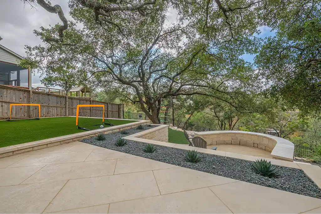 Hardscape 10 Outdoor Living Space Ideas Worth Stealing for Your Austin Backyard 7 Artificial turf adding functionality and beauty to a unique landscape in an Austin backyard