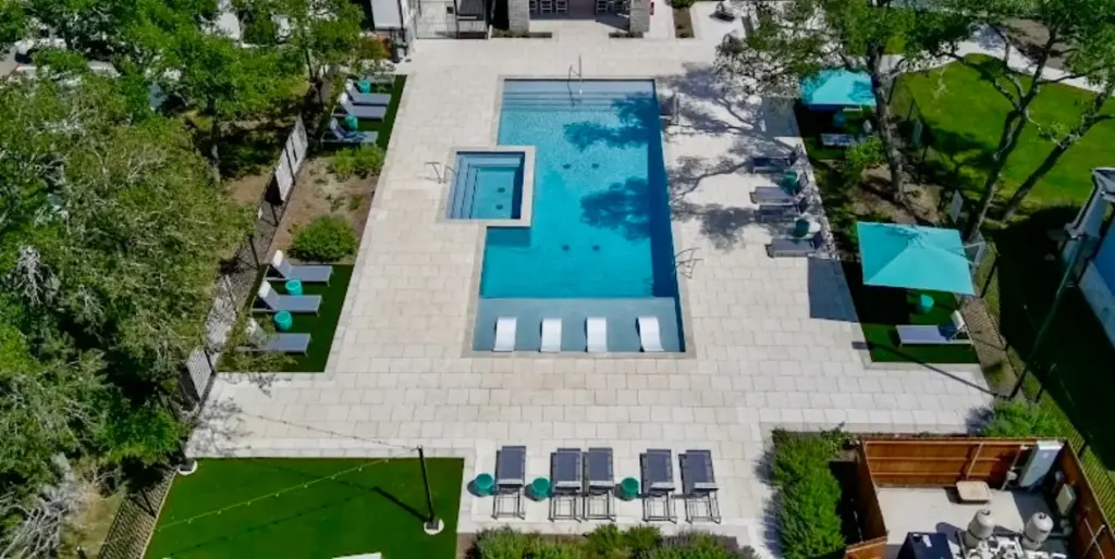 Hardscape 10 Outdoor Living Space Ideas Worth Stealing for Your Austin Backyard 9 Austin backyard with a beautiful outdoor living space including a pool and lounging areas