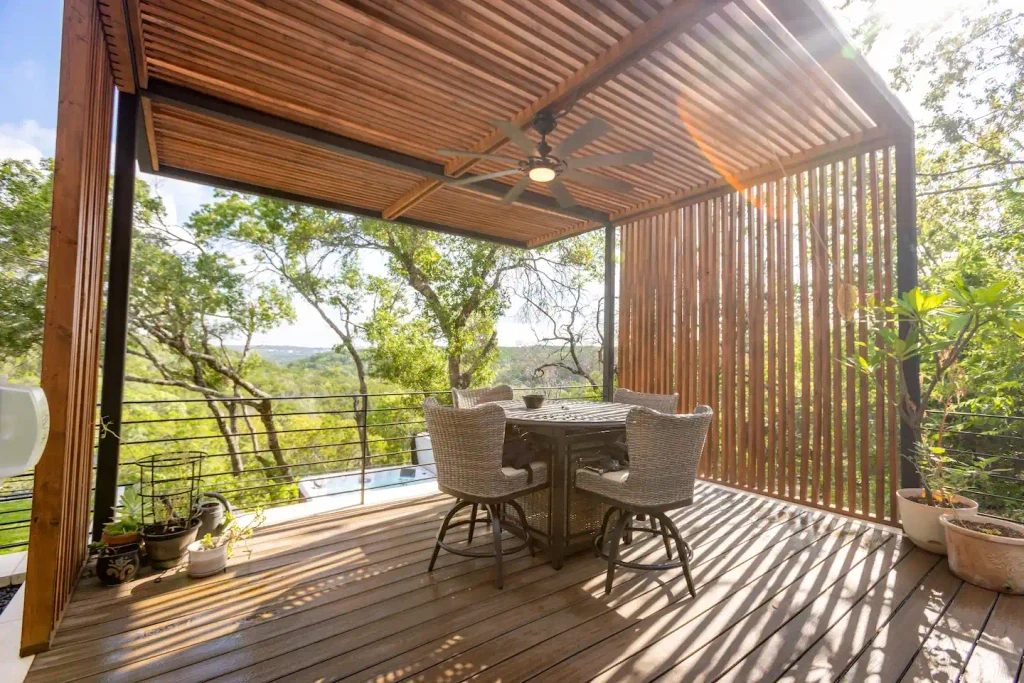 Elevated wood deck with cedar pergola cover overlooking Hill Country views in Austin